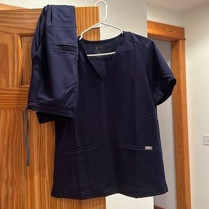 Navy figs - aya healthcare logo on top